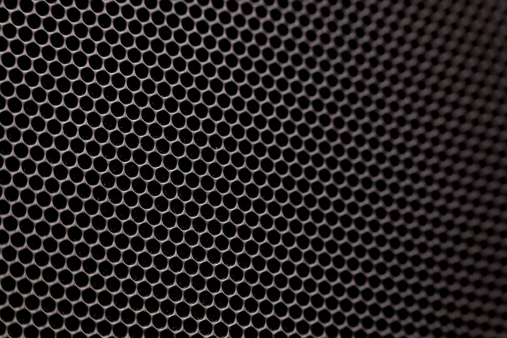 A detailed image showcasing a metallic honeycomb structure with hexagonal pattern, offering a modern texture.
