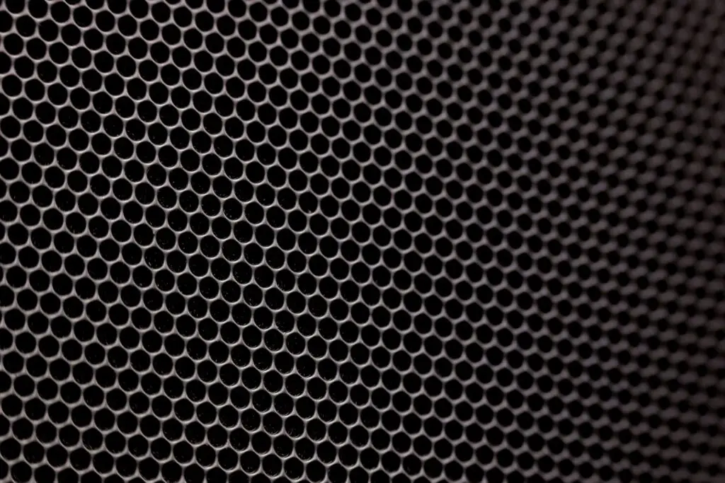 A detailed image showcasing a metallic honeycomb structure with hexagonal pattern, offering a modern texture.